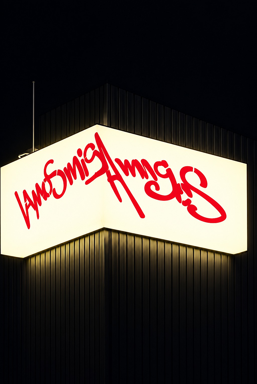 Vamos Cafe's illuminated corner sign at night, in red script lettering